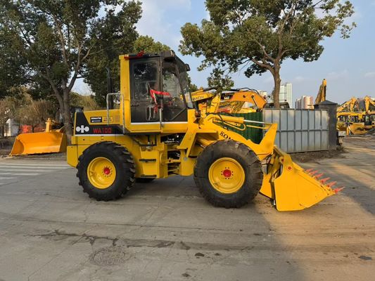 Оригинальная японская подержанная Komatsu WA100-1 колесные погрузчики работают в саду